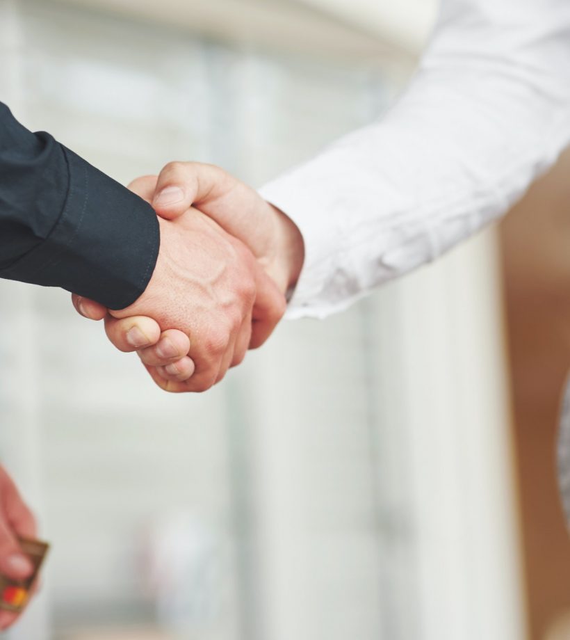 handshake-of-two-men-successful-business-contacts-after-a-good-deal.jpg